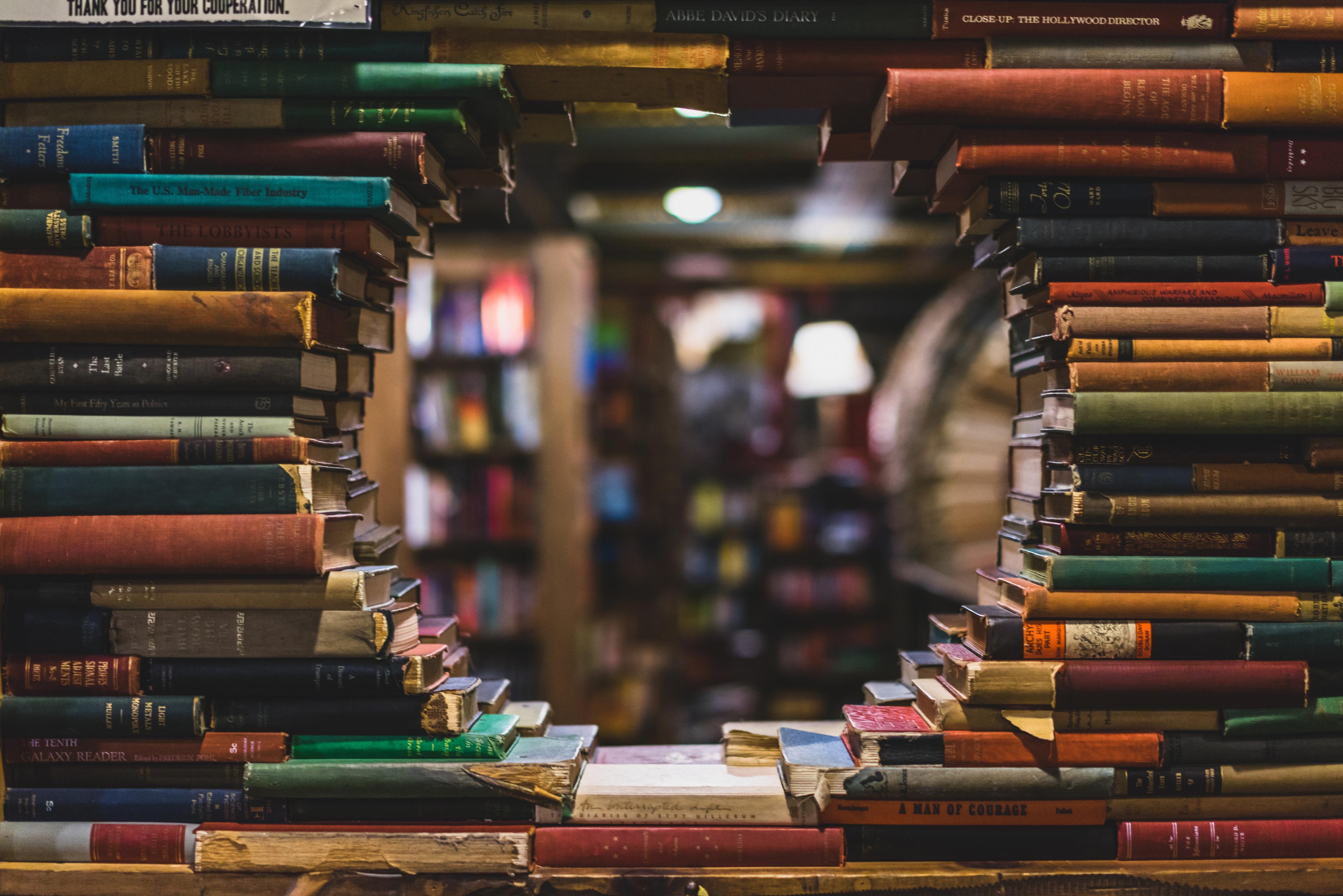 Background image with stacks of books and hole in a middle