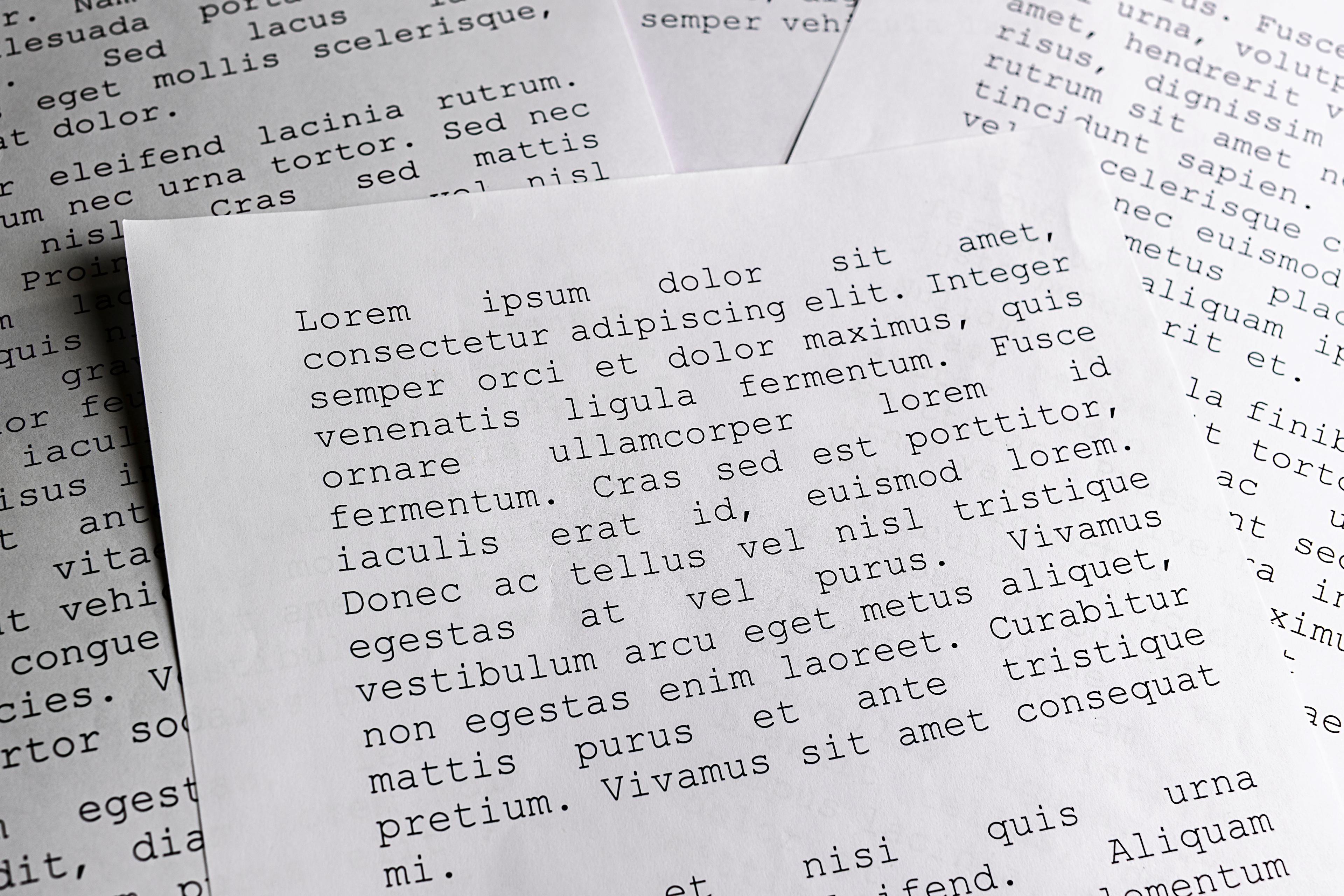 Some piece of papers with the 'Lorum ipsum' text on it.